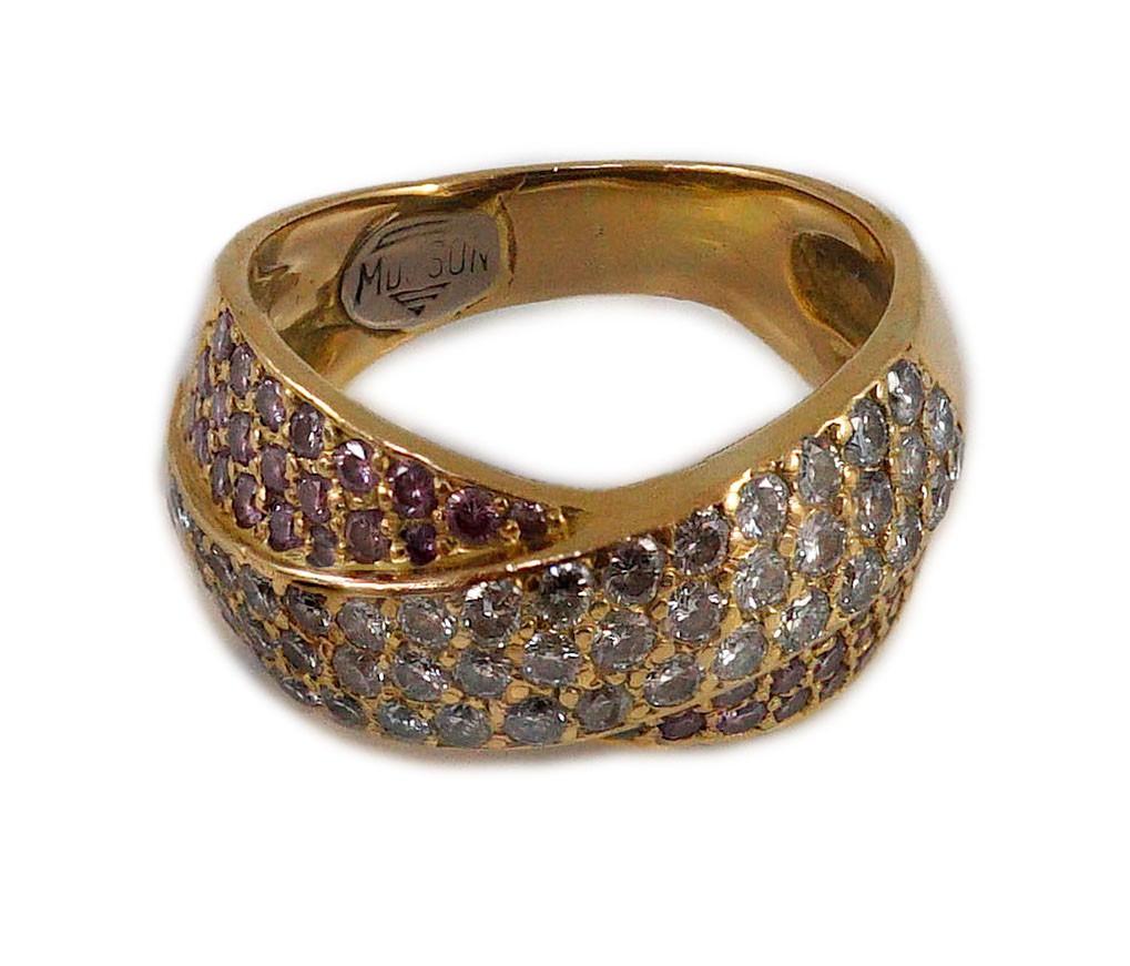 A modern gold (tests as 18ct), pink and white pave set diamond cross over ring, by Musson